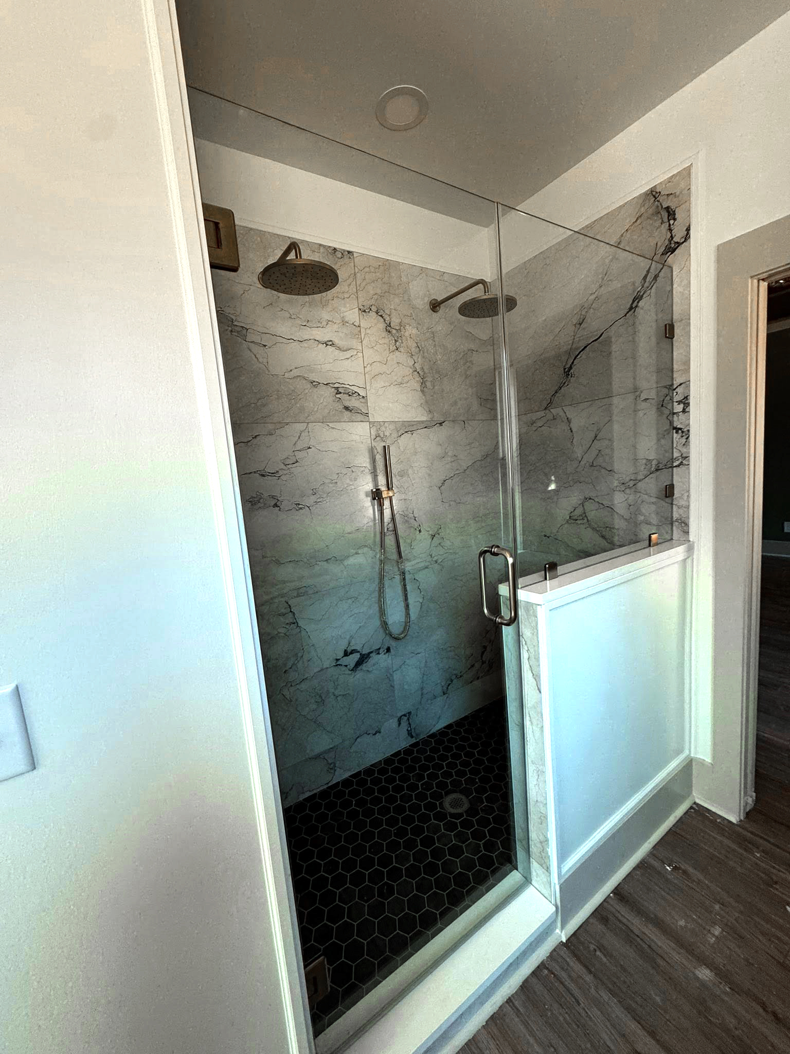 Mod Plan 041-216 walk-in shower with marble tile and dual rain heads
